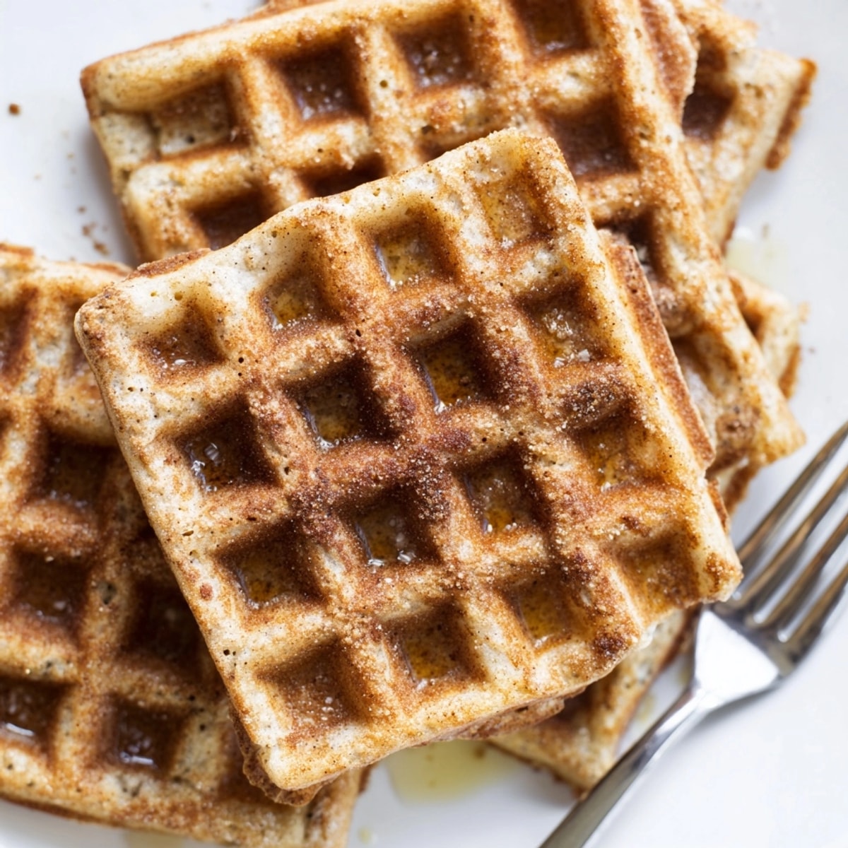 Golden Cinnamon Vanilla Oat Waffles, crispy edges, soft center, ready for maple syrup.