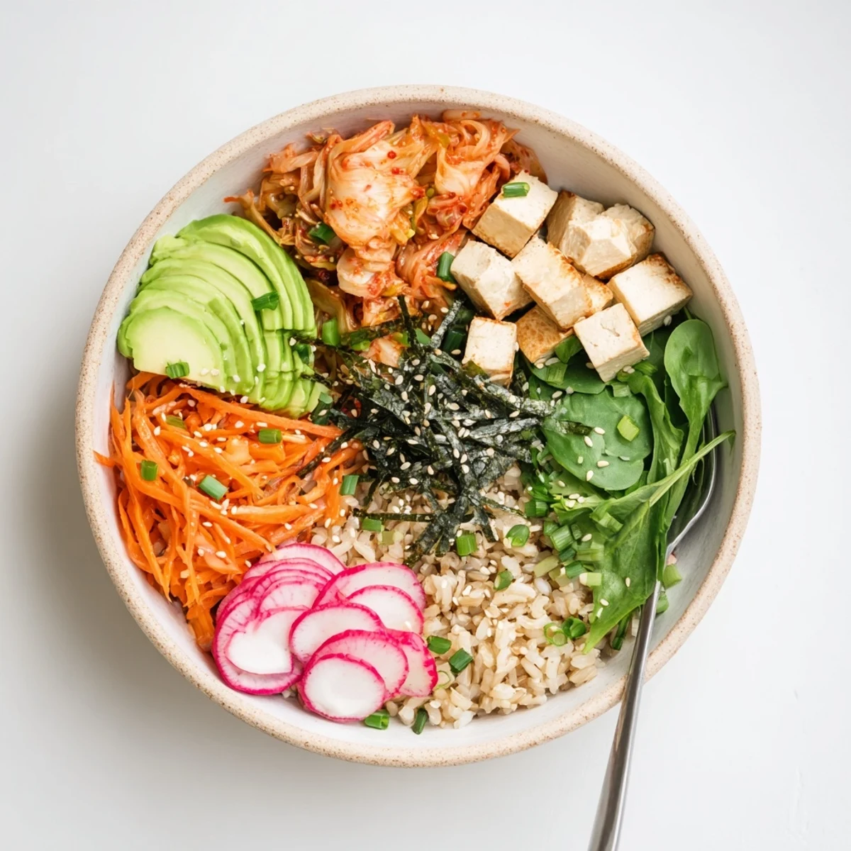 Vibrant fermented vegetable bowl with tangy kimchi, fresh veggies, and hearty grains.  
