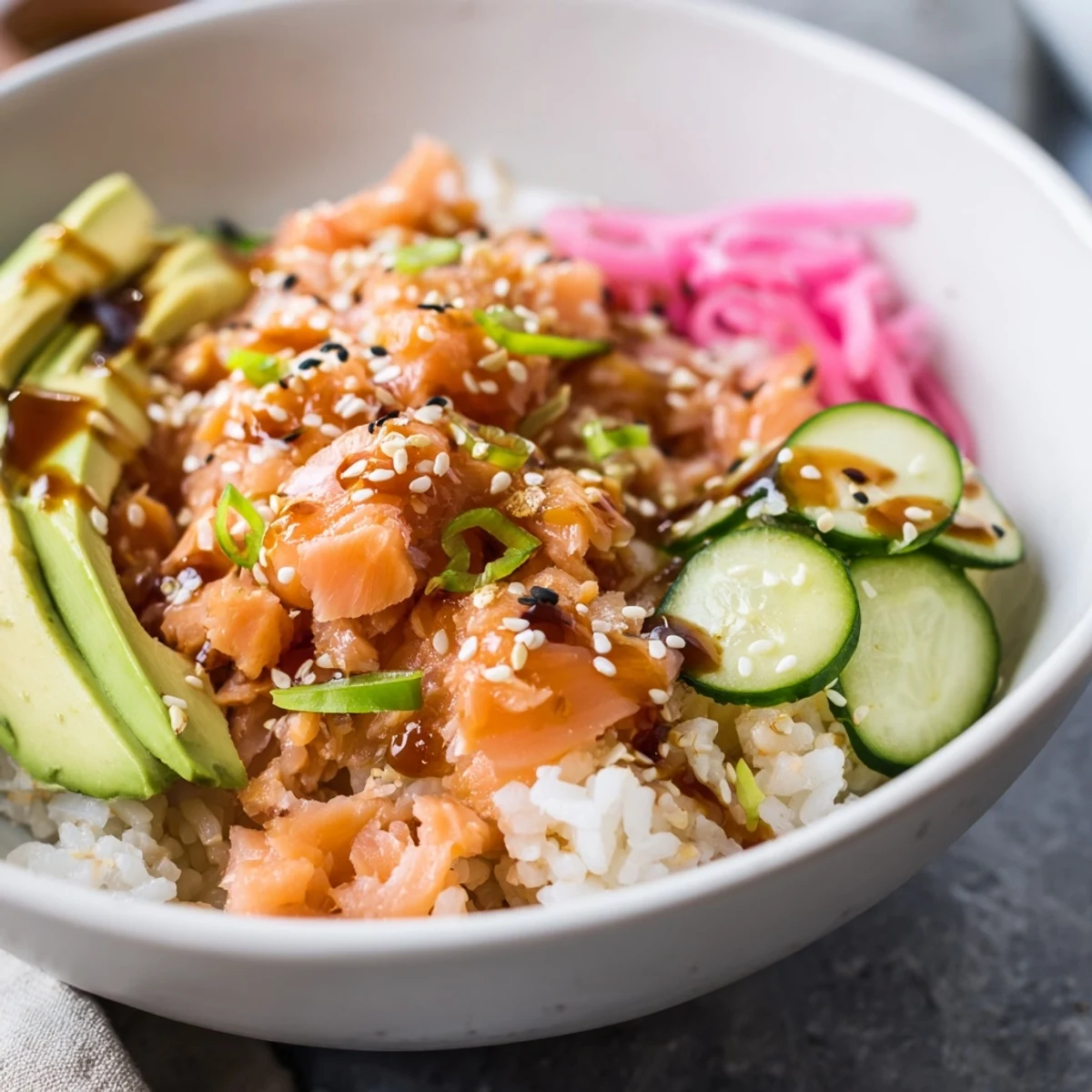 Delicious leftover salmon and rice bowl topped with fresh avocado and ginger.  