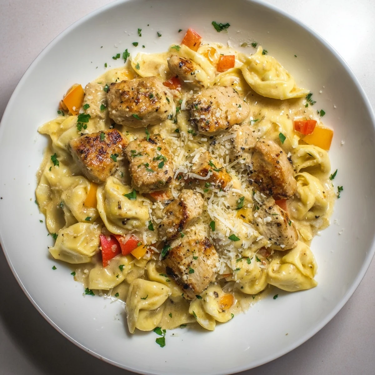 Golden-brown Zesty Cajun Garlic Parmesan Chicken Tortellini, bursting with garlic, pepper, and Cajun spices, ready to enjoy.