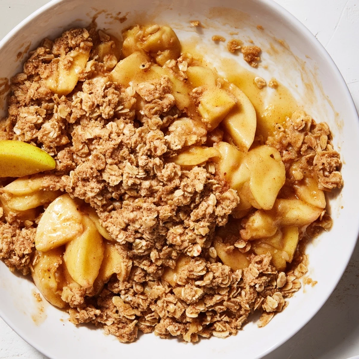 Golden, bubbly Apple Crisp with oat topping, perfect warm with vanilla ice cream.
