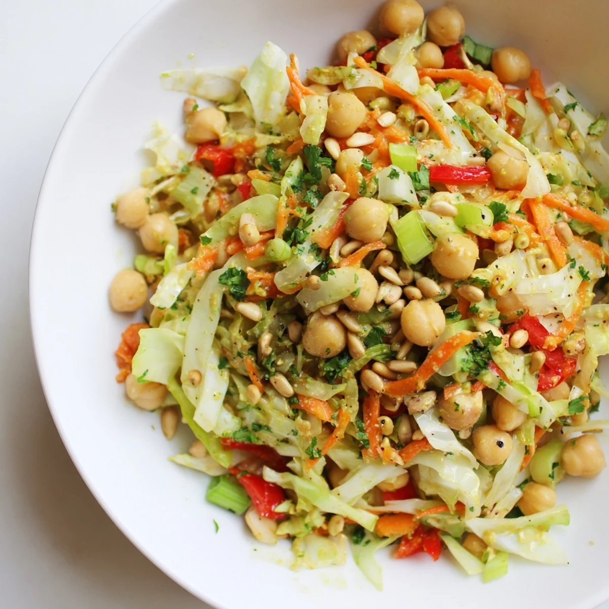 Vibrant fiber-forward chickpea salad with creamy dressing, perfect for a light, refreshing lunch.