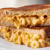 A comforting, melted cheese pull is visible on the gooey Mac & Cheese Grilled Cheese sandwich filling.