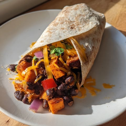 Warm, golden Sweet Potato & Black Bean Breakfast Burrito, perfectly wrapped and ready to enjoy for breakfast.