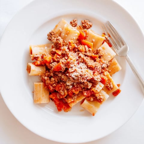 A steaming bowl of Classic Tuscan Ragu, rich and hearty, ready to be served over pasta.