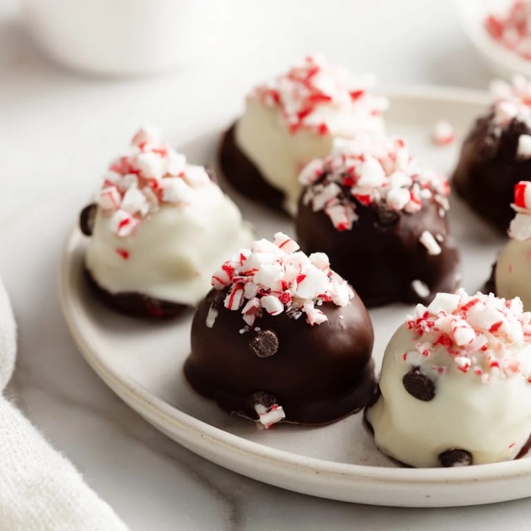 Indulgent Charcuterie Board Peppermint Bark Balls topped with peppermint and chocolate, a delightful seasonal treat.