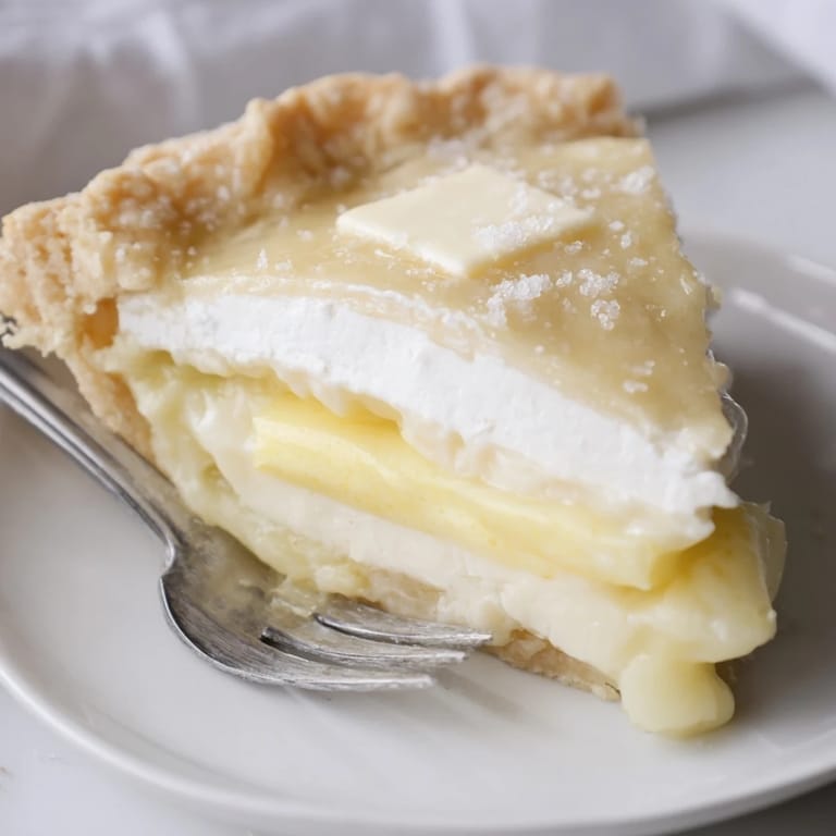 Nostalgic water pie with golden crust, drizzled with vanilla for delicious sweetness.  