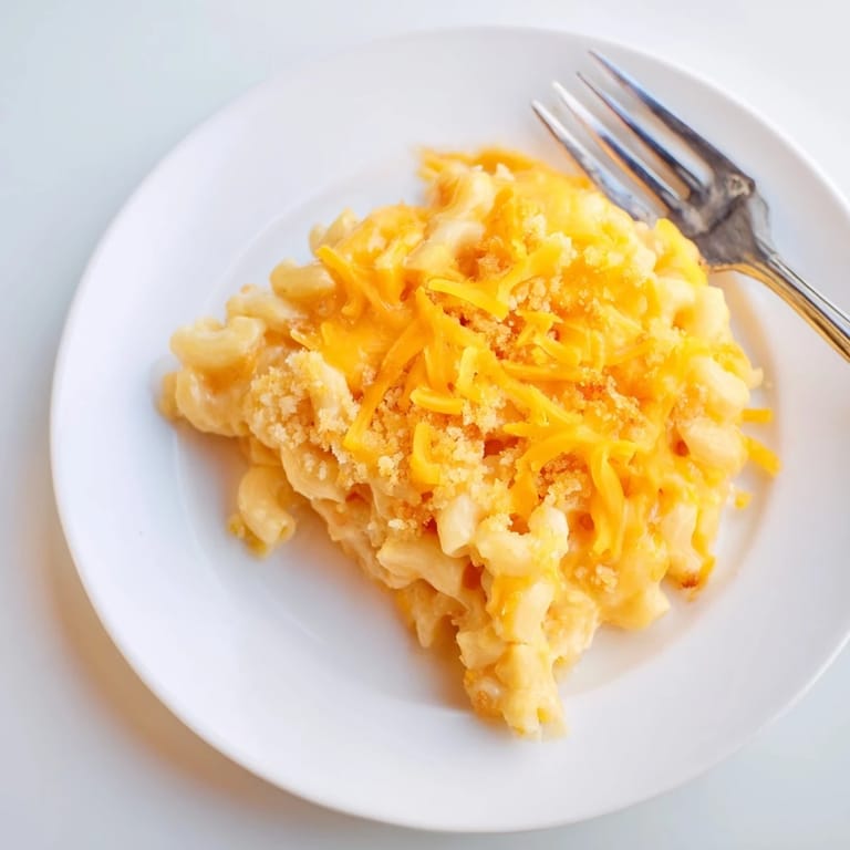 A close-up view of cheesy, creamy Old-Fashioned Baked Mac & Cheese, fresh from the oven, ready to serve.