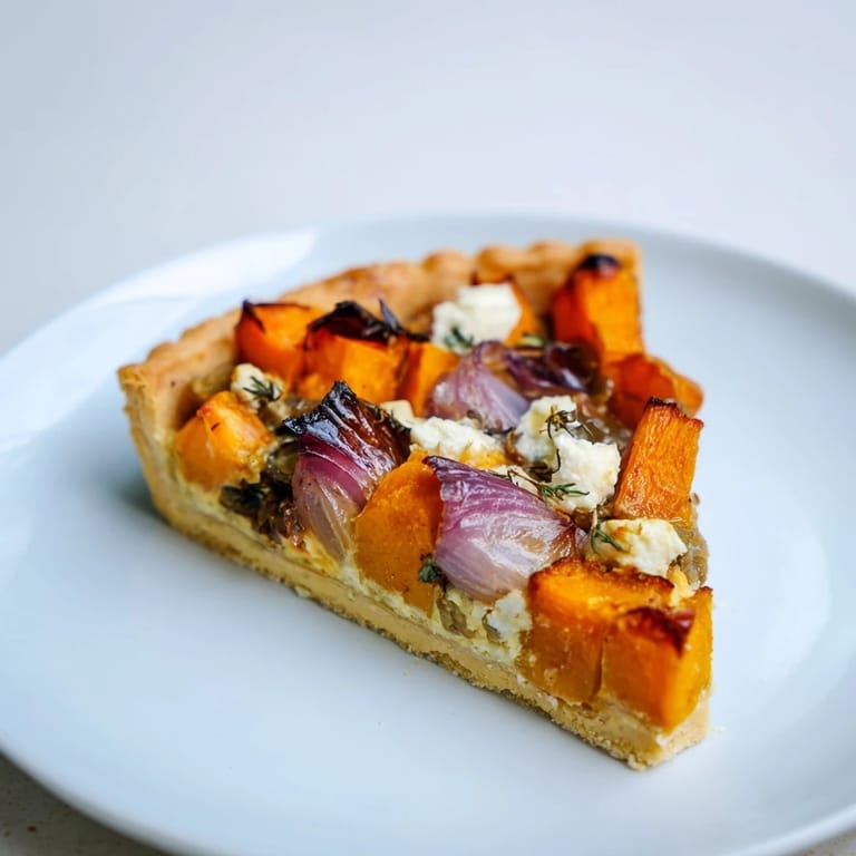 The caramelized onions and goat cheese top this savory Feuilles dÉrable Tartes Salées dAutomne.