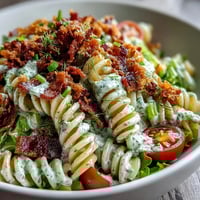 Creamy BLT Pasta with Avocado Ranch, a colorful summer pasta salad with crispy bacon, juicy tomatoes, and fresh lettuce.  